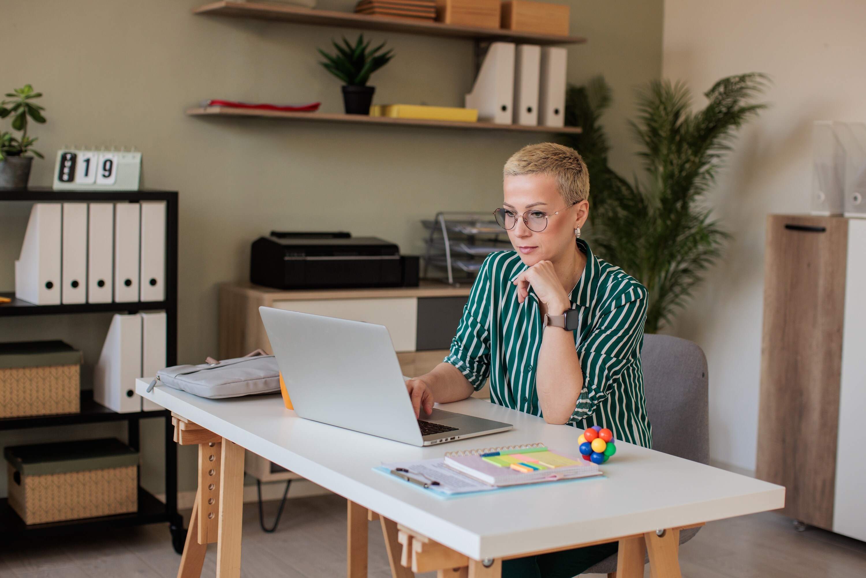 Lady reading her computer in office