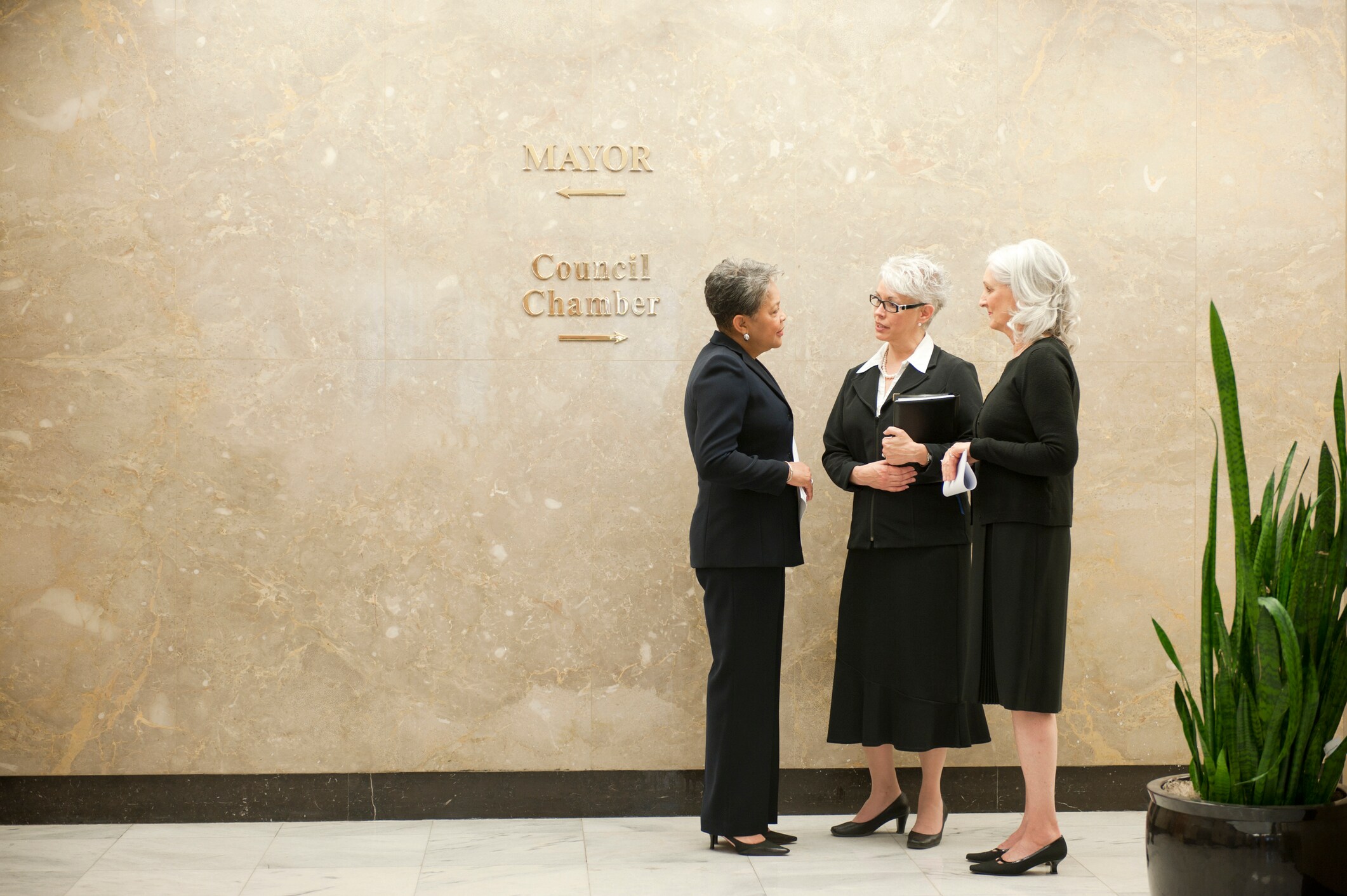 Women standing in a government building
