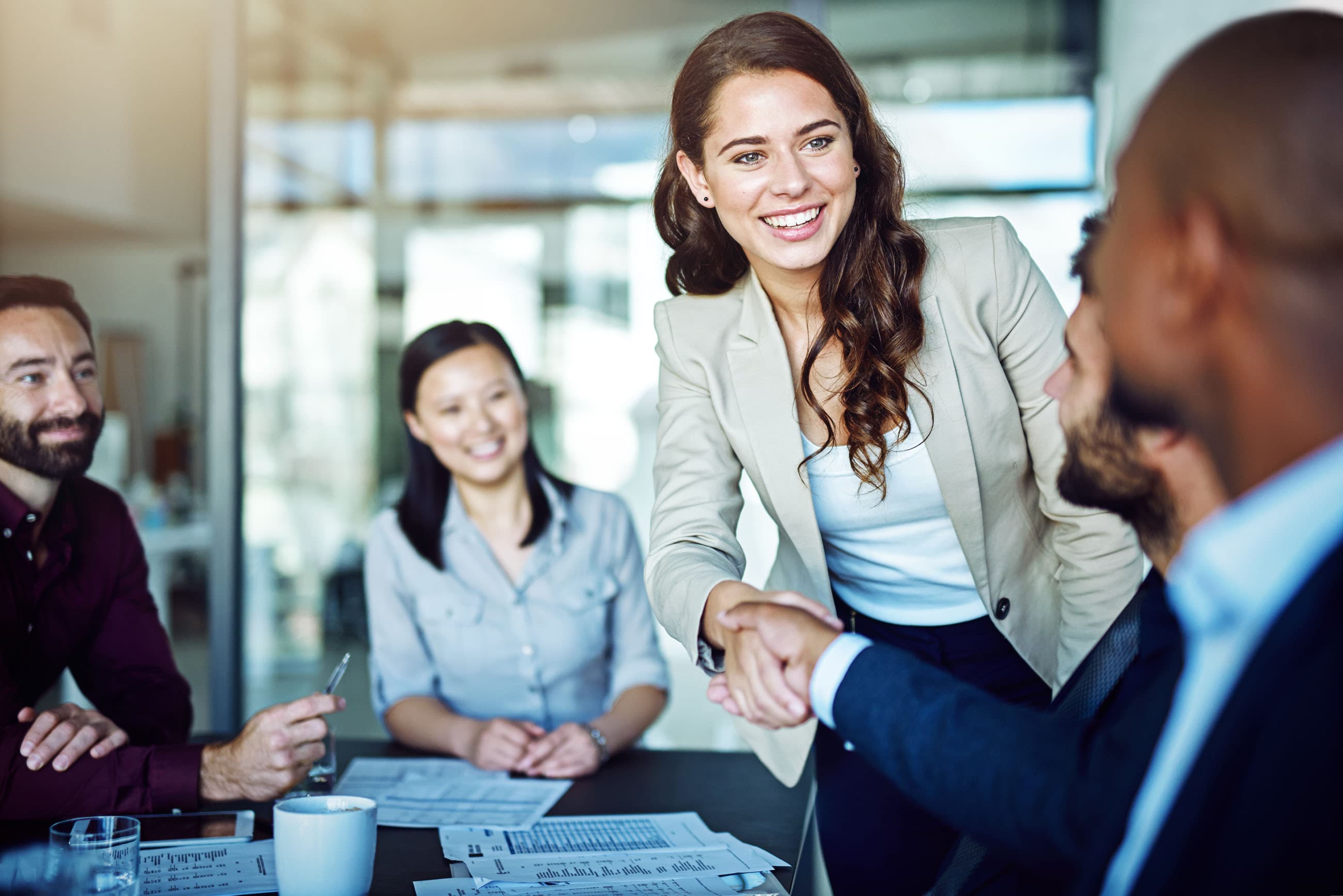 Shaking hands at a business meeting