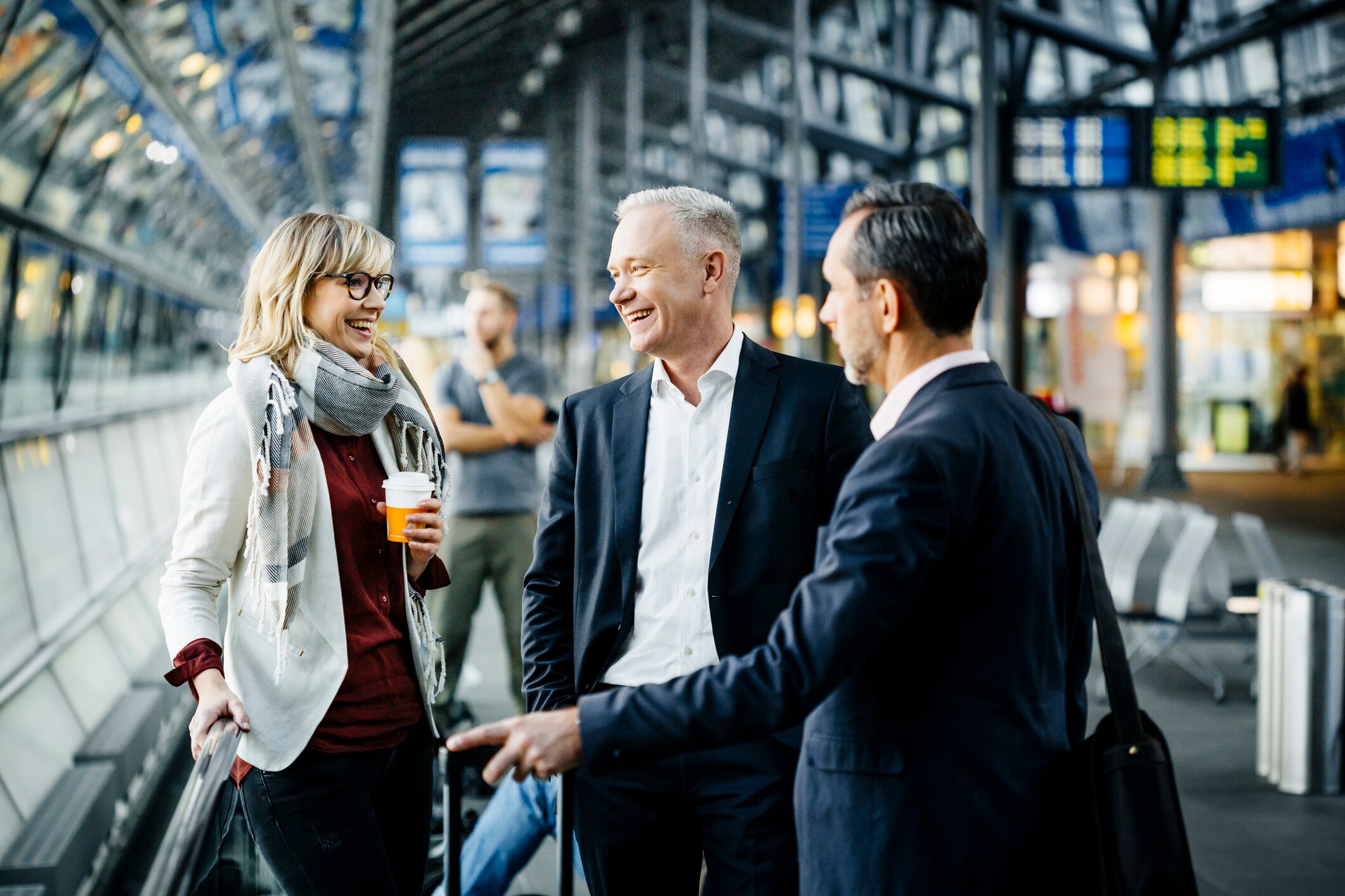 Group of mature business people meeting at the airport