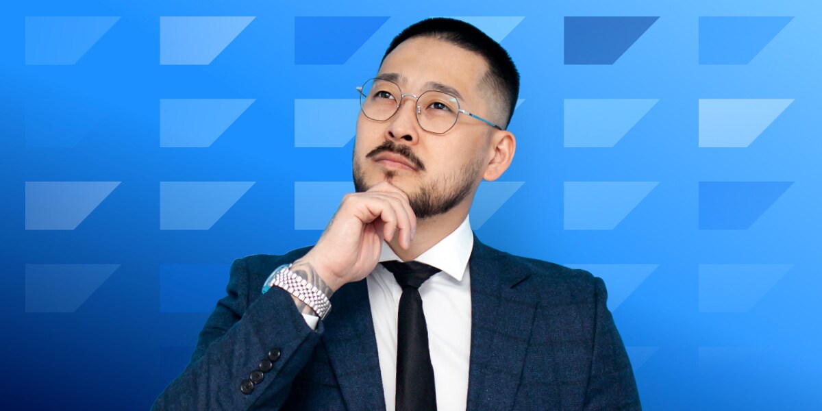 Man wearing glasses looking thoughtfully