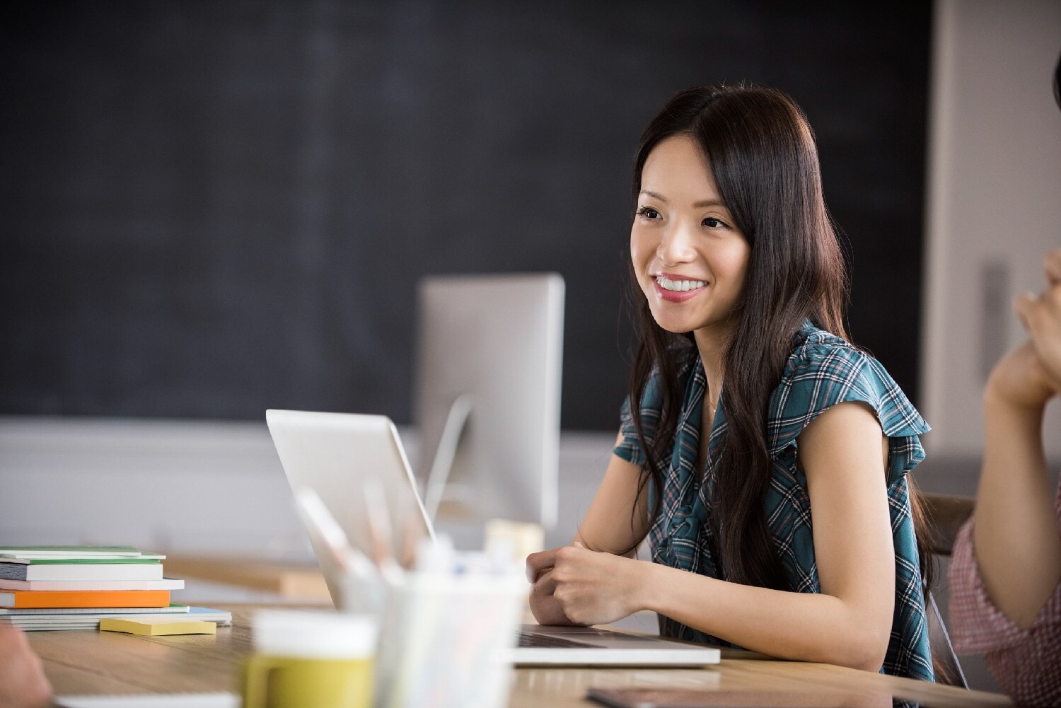 Woman sitting at computer