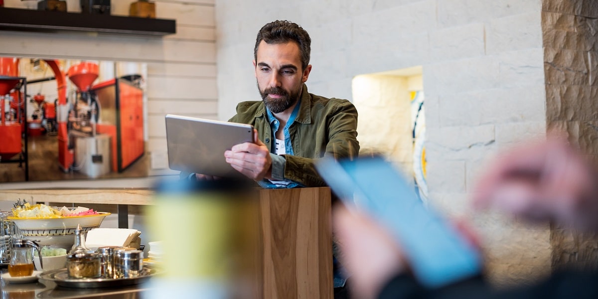 Man sitting in a cafe working
