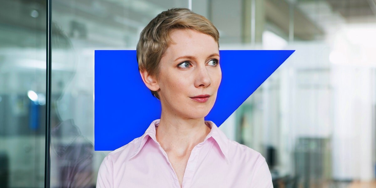 Woman in workplace looking out window