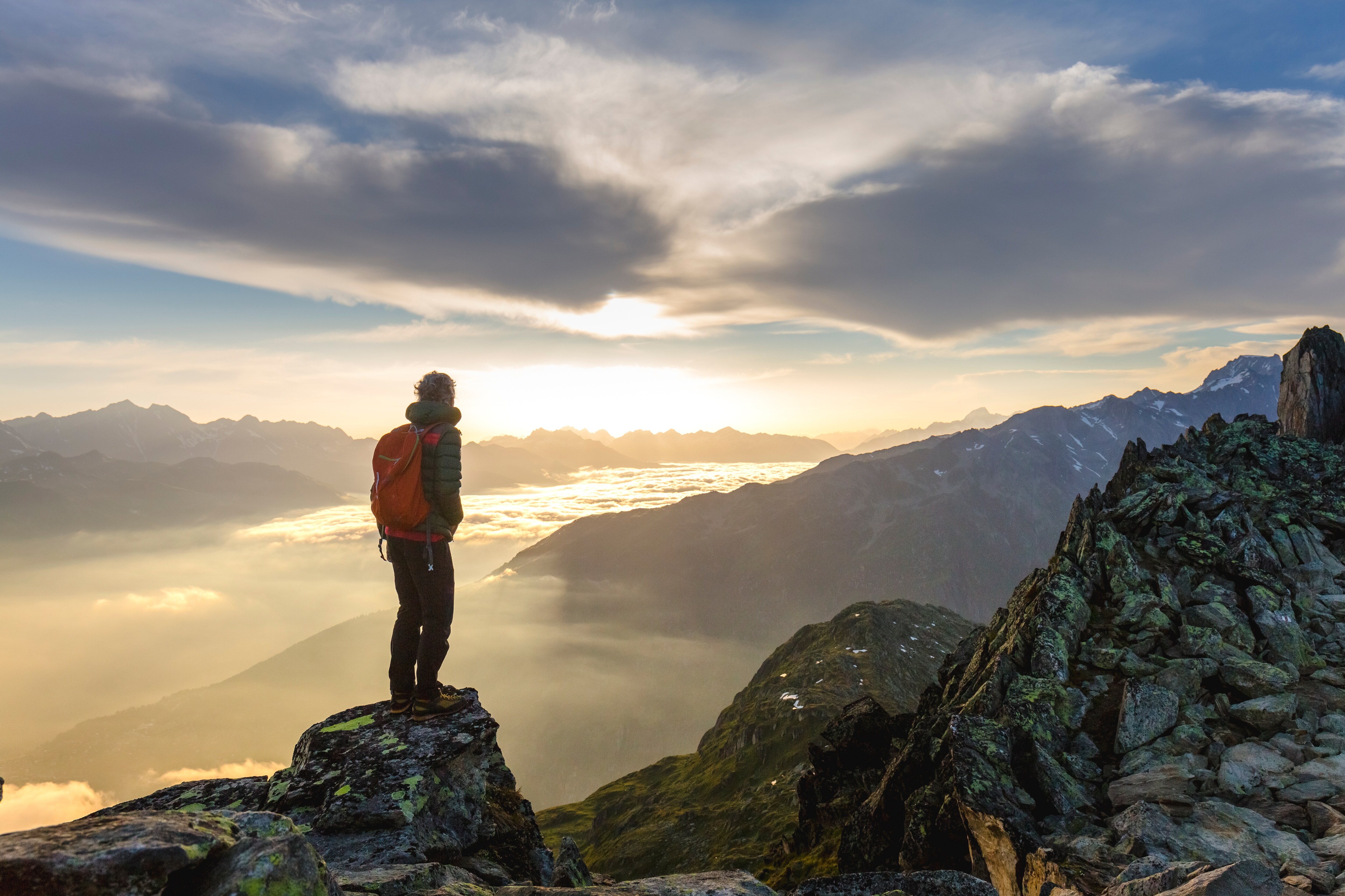 person standing on top of a mountain 