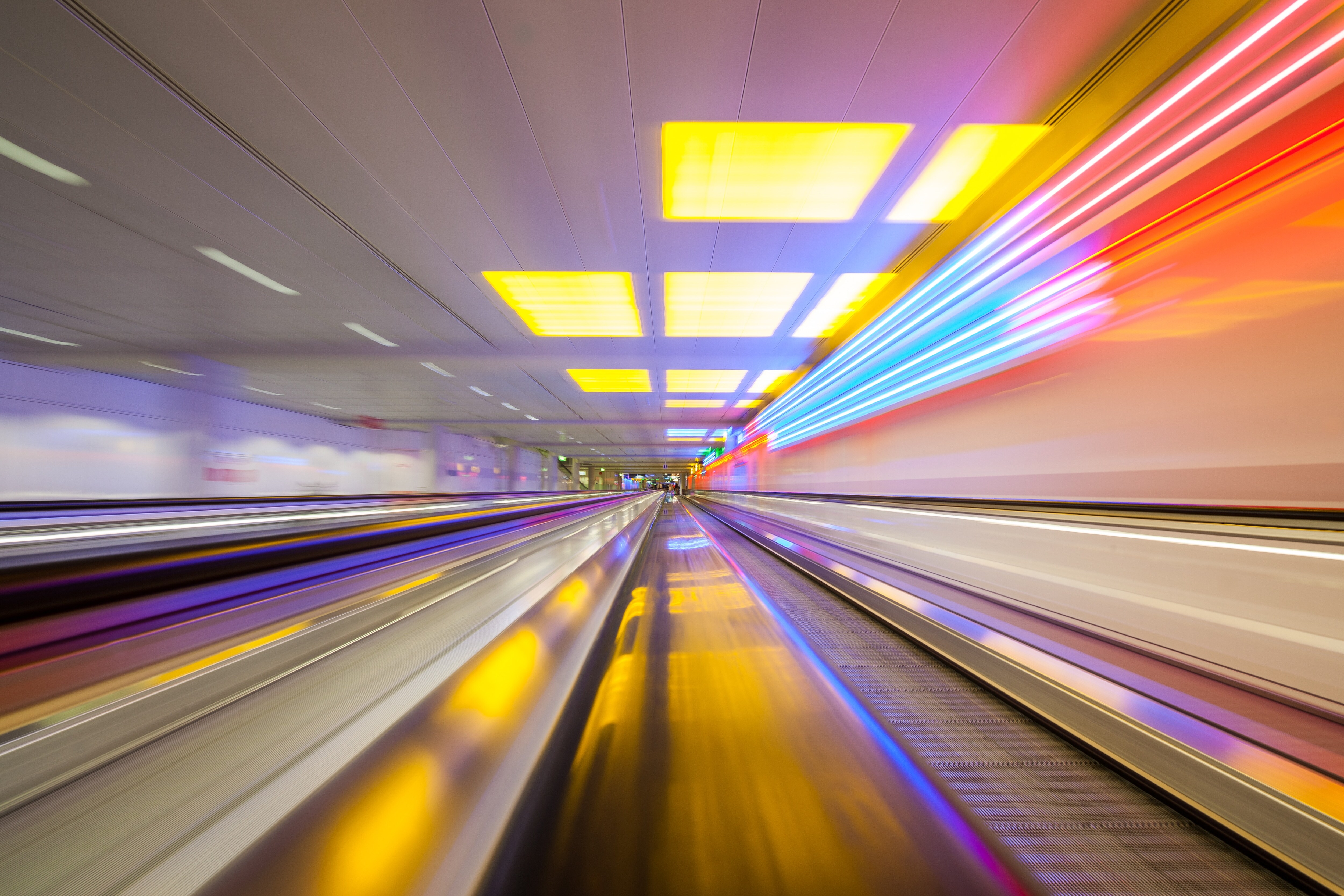 Blurry and colorful representation of train speeding through train station