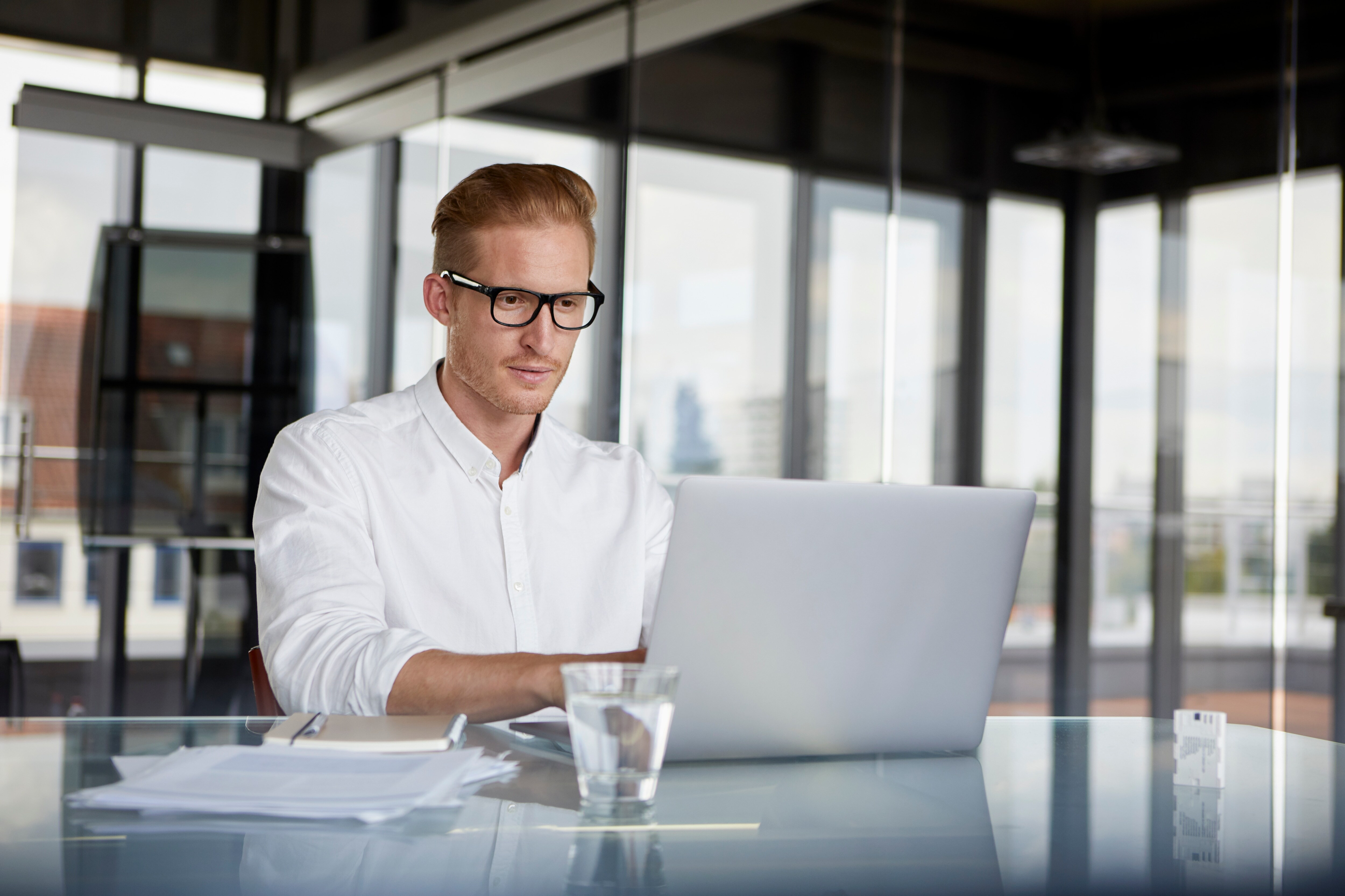 a businessman looking at his laptop