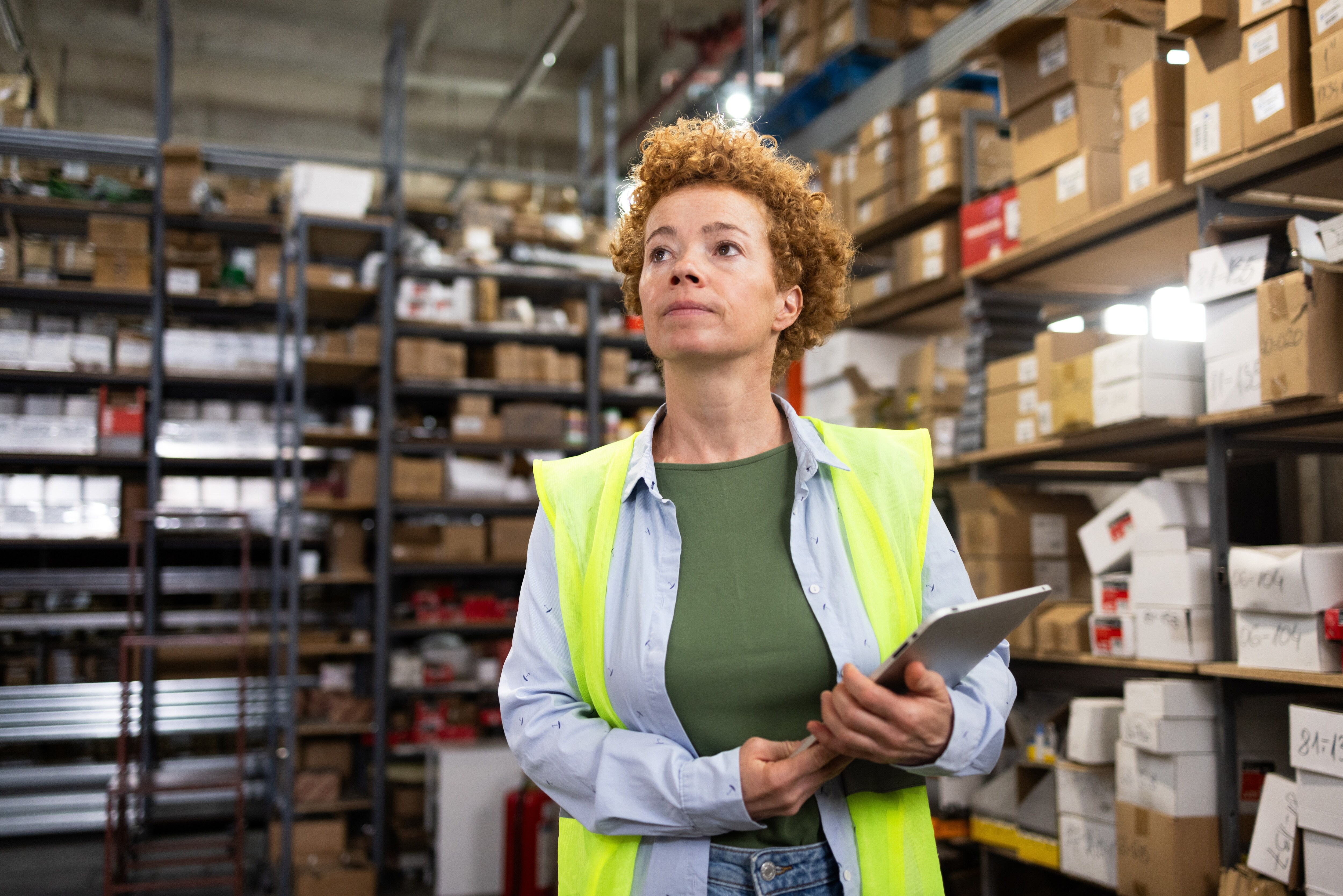 Three people walking with a computer talking