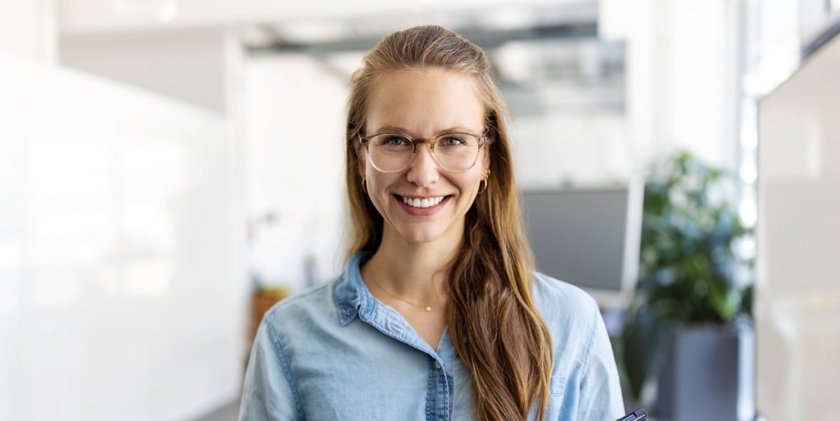 woman with long hair and glasses