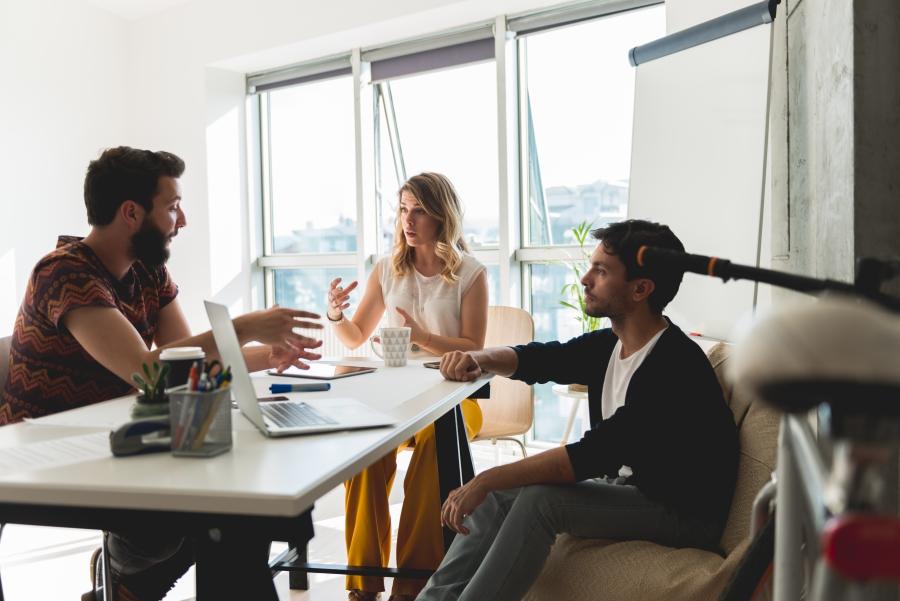 team of three working in office