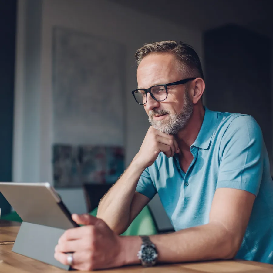 Man working and looking at tablet