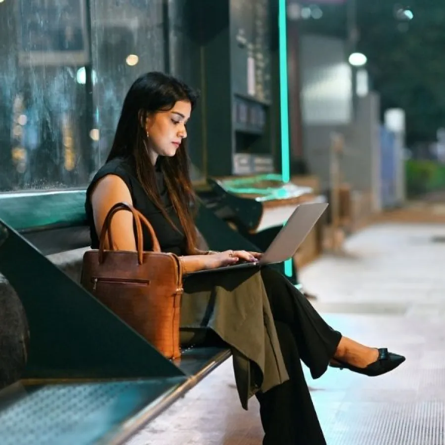 woman working on laptop outside