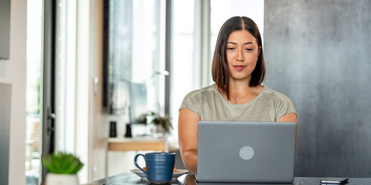 Woman in an office looking at a computer screen